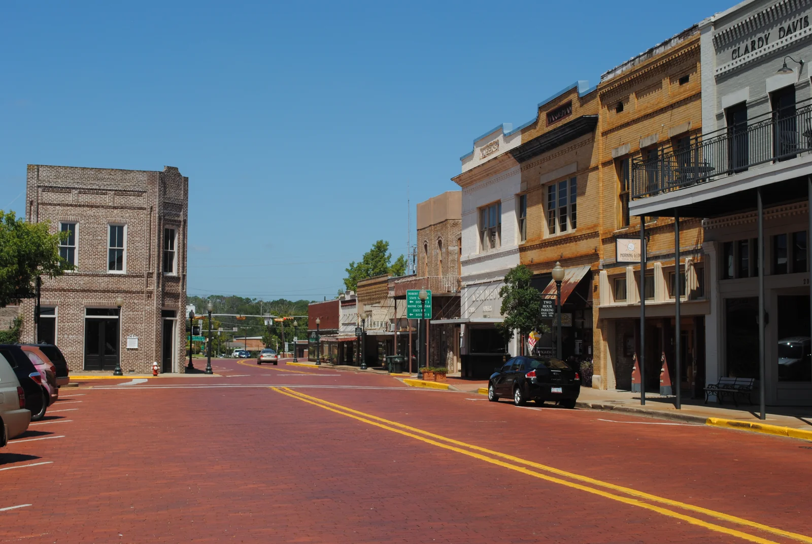 Brick street and historic downtown storefronts in Nacogdoches, Texas